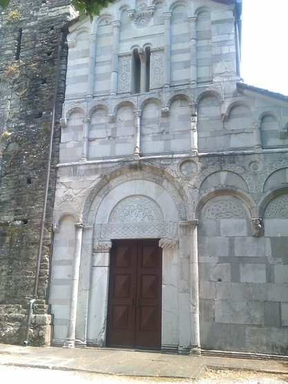 The ancient church tower and facade at San Cassiano