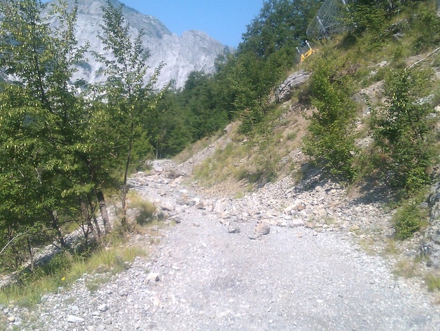 boulders and bulldozer on the road to Roggio following recent earthquake damage Picture